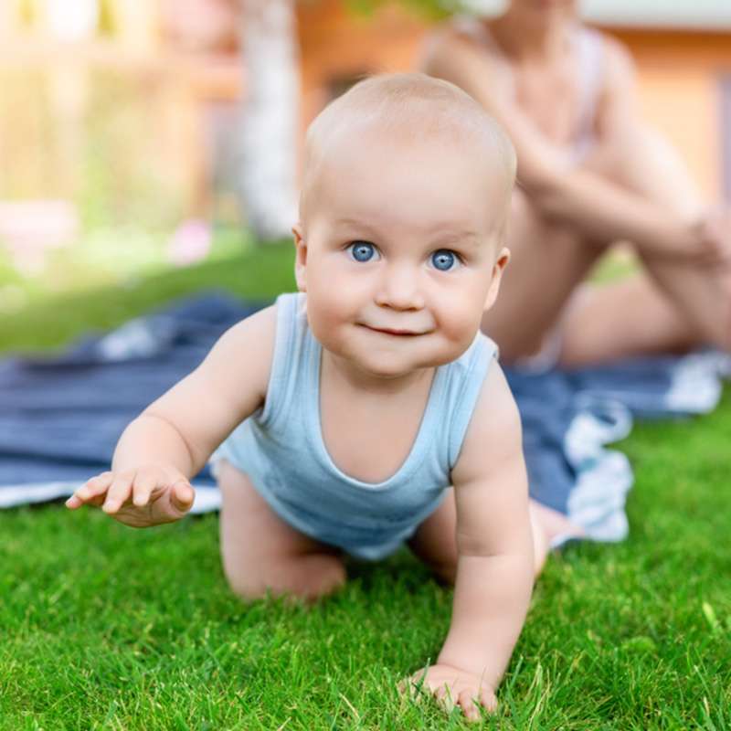 Baby crawling and smiling